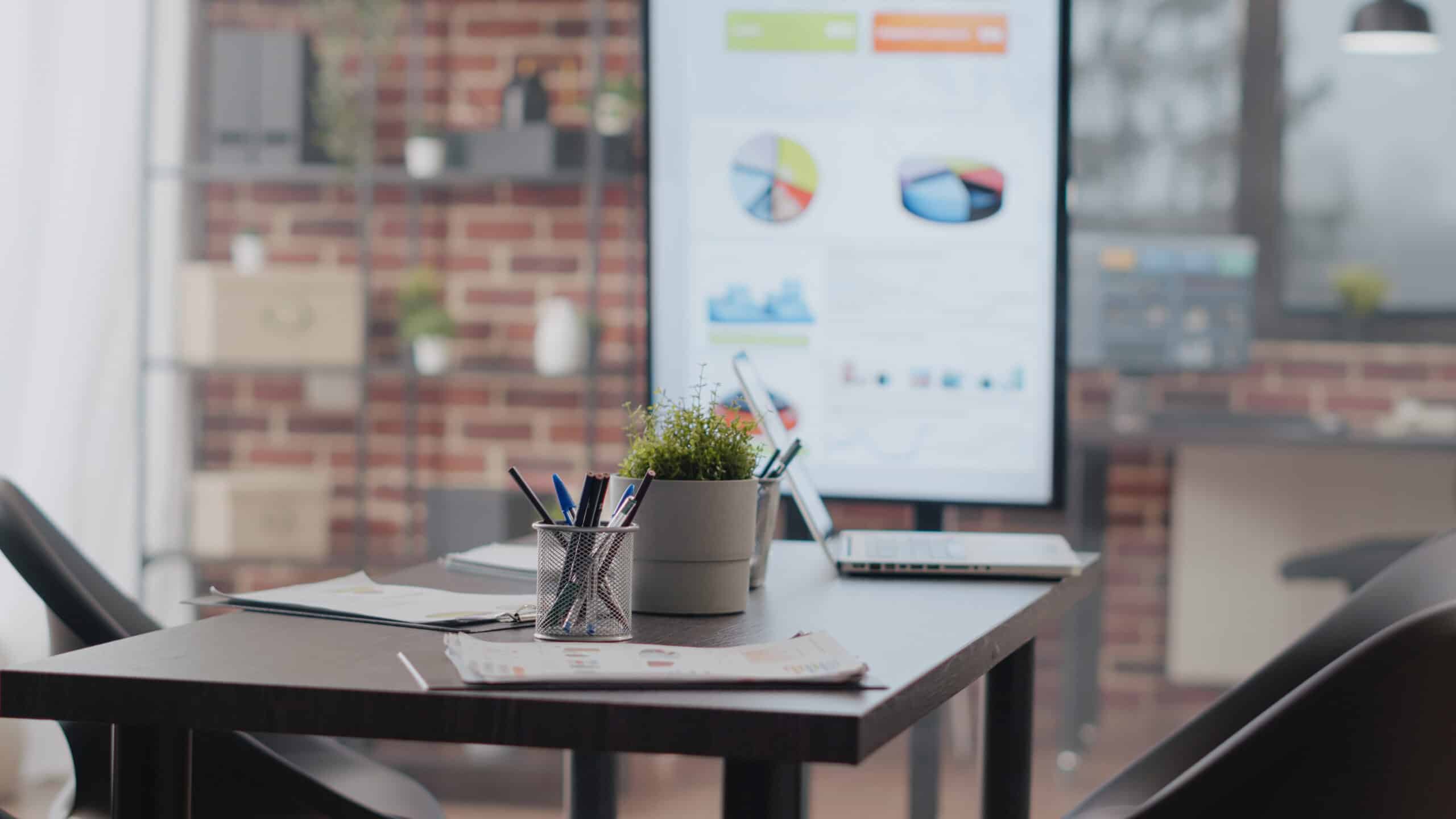 close up of empty desk used for business meeting in office