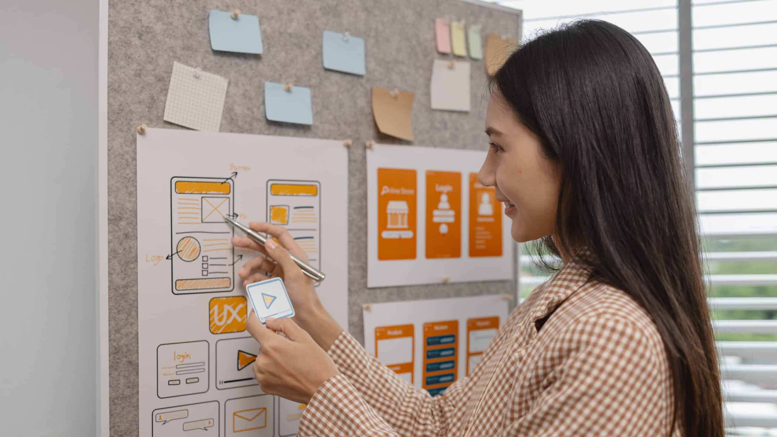 ux developer and ui designer brainstorming about mobile app interface wireframe design in the office, website designer, creative planning phone app development template